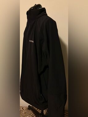 Softshell Black OKEMO ski & snowboard Jacket with Red Trim zipper accent.